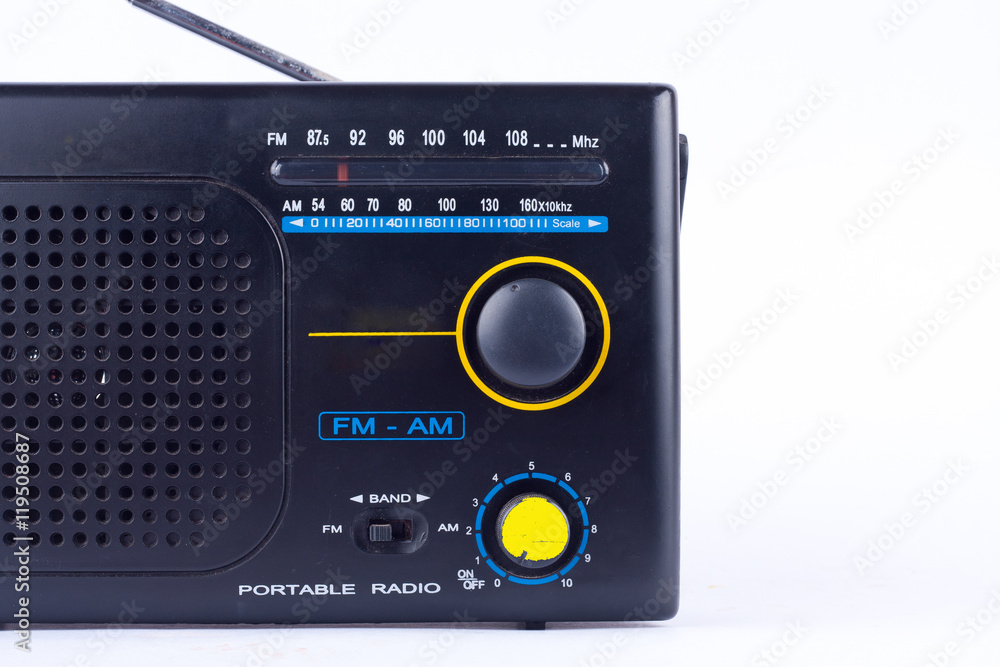 AM, FM portable radio transistor receiver of black vintage retro style on white background isolated close up
AM, FM portable radio transistor receiver of black vintage retro style on white background isolated close up