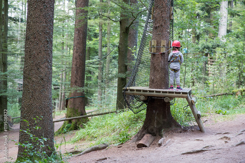 Young girl at tree climbing