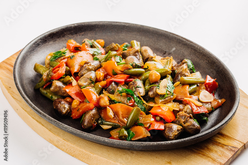 Fried chicken hearts with vegetables