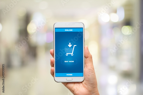 Female hands using smart phone for online shopping on Background blur mall ,Mobile e-commerce business concept.