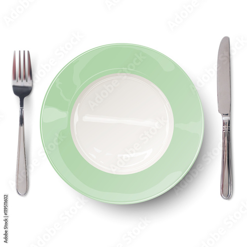 Empty plate in green design with knife and fork isolated