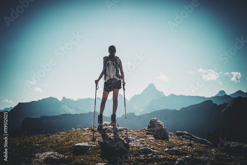Vignette of hiker with poles near summit