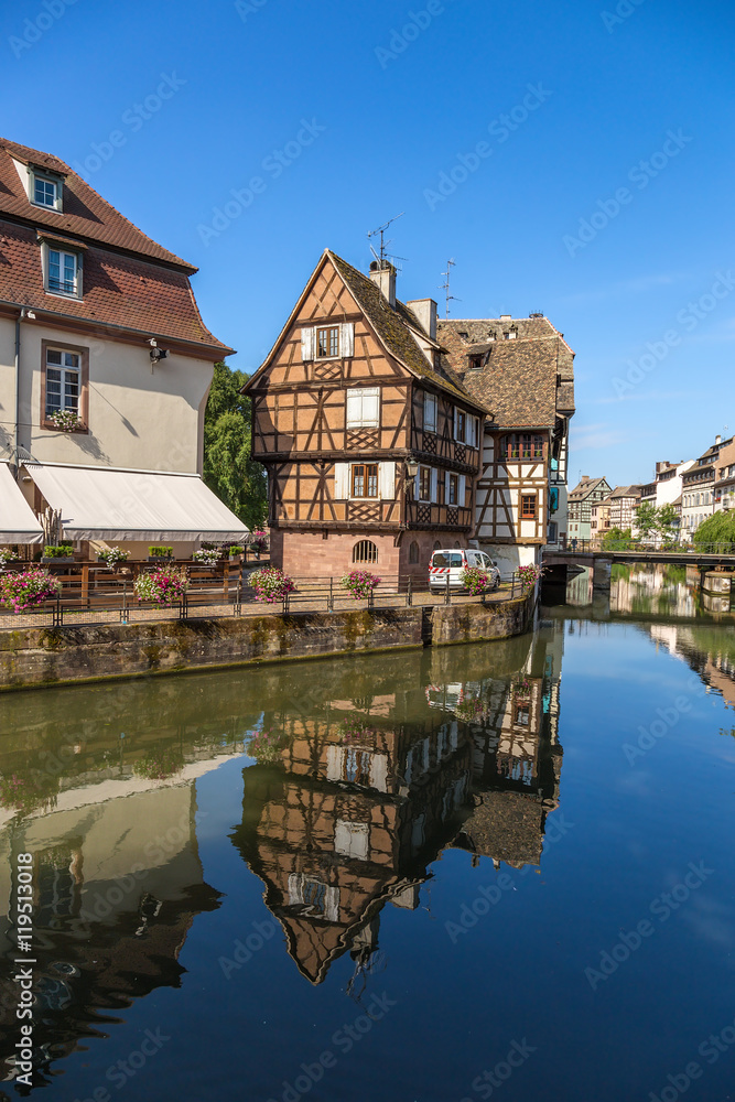 Strasbourg, France. The picturesque landscape with reflection in the water of old buildings in the historic quarter 