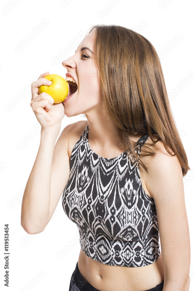 Young girl eating an apple portrait of a close-up isolated on white background. Concept of diet and weight loss. Young girl eating an apple portrait of a close-up isolated on white background. Concept of diet and weight loss.