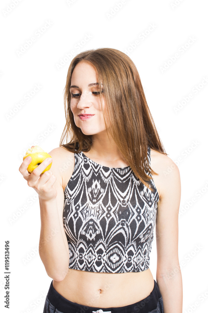 Young girl eating an apple portrait of a close-up isolated on white background. Concept of diet and weight loss. Young girl eating an apple portrait of a close-up isolated on white background. Concept of diet and weight loss.