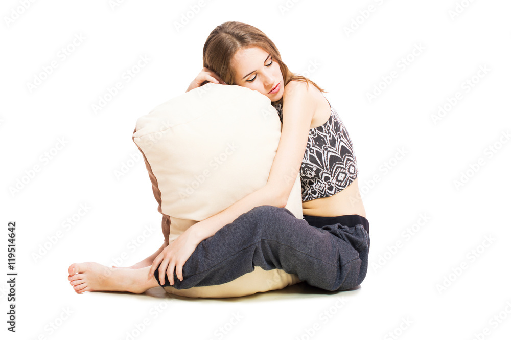 Artistic young girl with a pillow isolated on white background. Artistic young girl with a pillow isolated on white background.