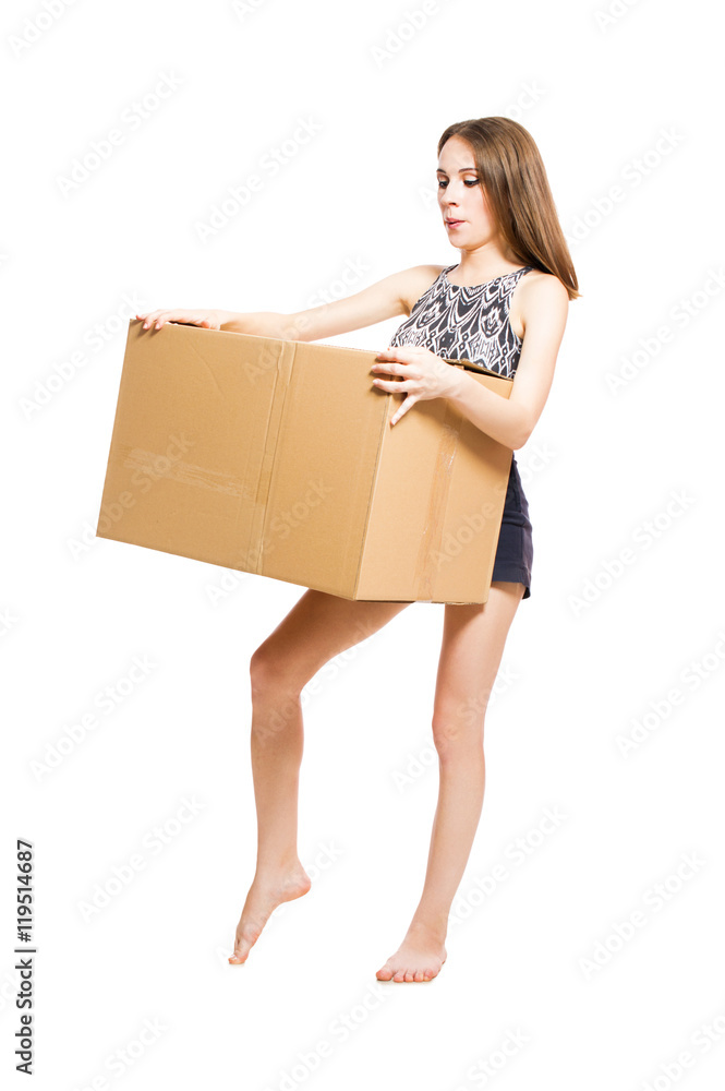Young girl holding a large box isolated on white background. Young girl holding a large box isolated on white background.