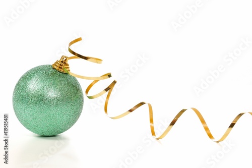 Photography Green Christmas ball and serpentine on a white background