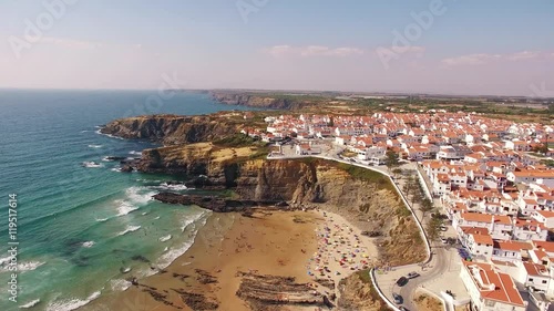 Panoramic view of Zambujeira de Mar and beach with holidaymakers people aerial view photo