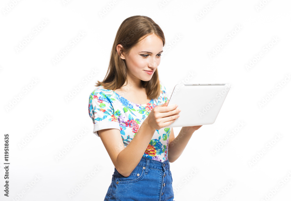 Funny young girl with a tablet isolated on white background. Funny young girl with a tablet isolated on white background.