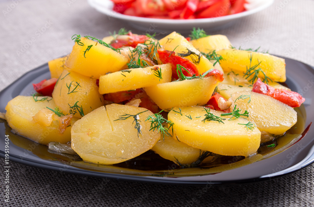 Close Up view on stew of potatoes with onion, bell pepper and fe Close Up view on stew of potatoes with onion, bell pepper and fe