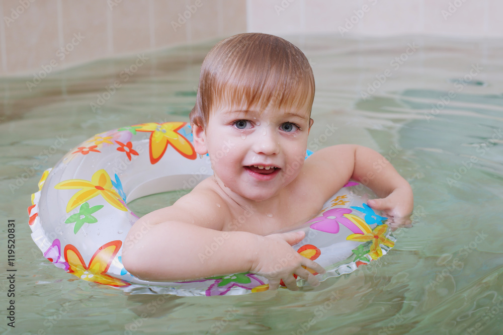 little happy boy swimming in pool little happy boy swimming in pool
