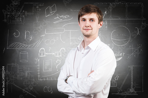 Businessman over school chalk board background