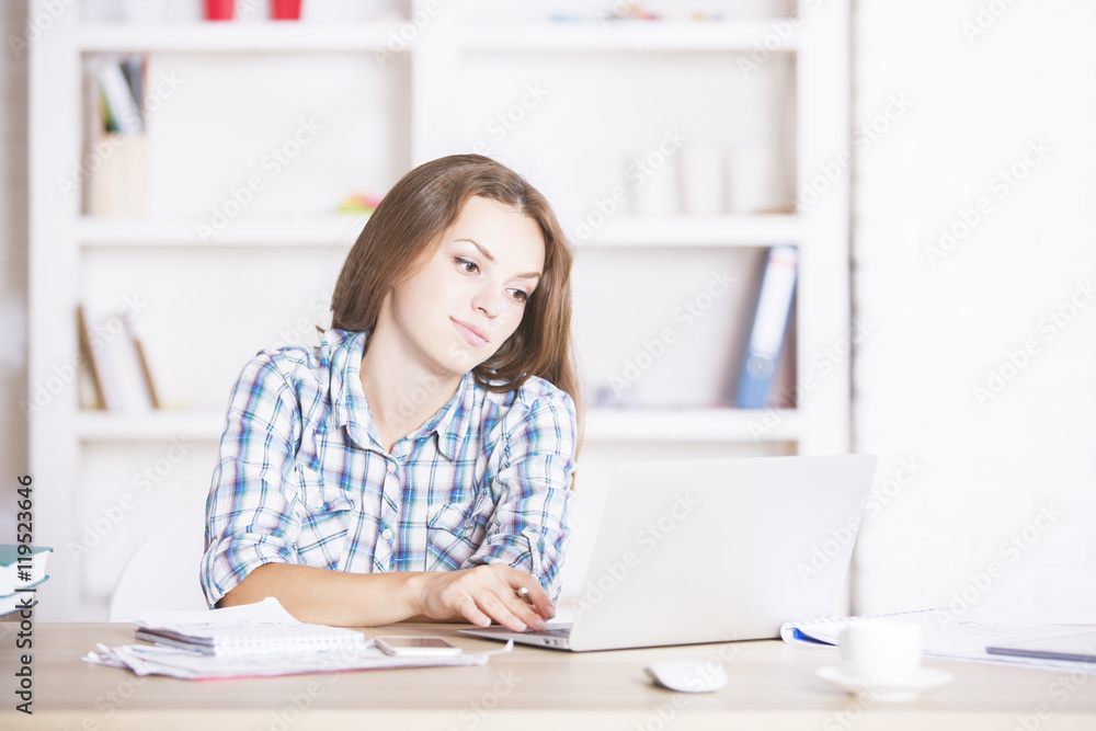 Young woman using laptop computer Young woman using laptop computer