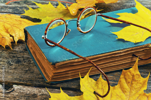 old glasses on a book