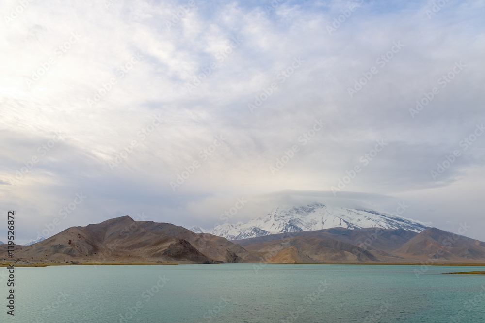 Mount Muztag Ata, the father of ice mountains, and the Karakul Lake, on the Pamirs Plateau, Taxkorgan, Kashgar, Xinjiang, China