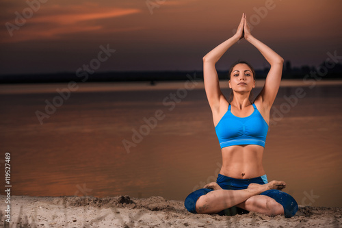 yoga at sunset on the beach.