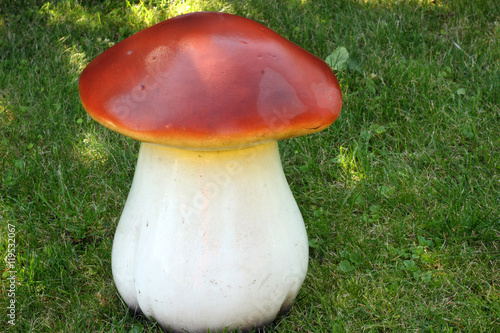 Ceramic mushroom on green grass