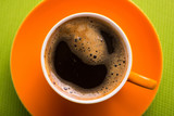 Orange cup of coffee