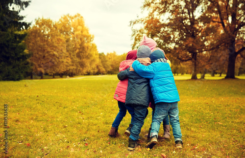 group of happy children hugging in autumn park © Syda Productions