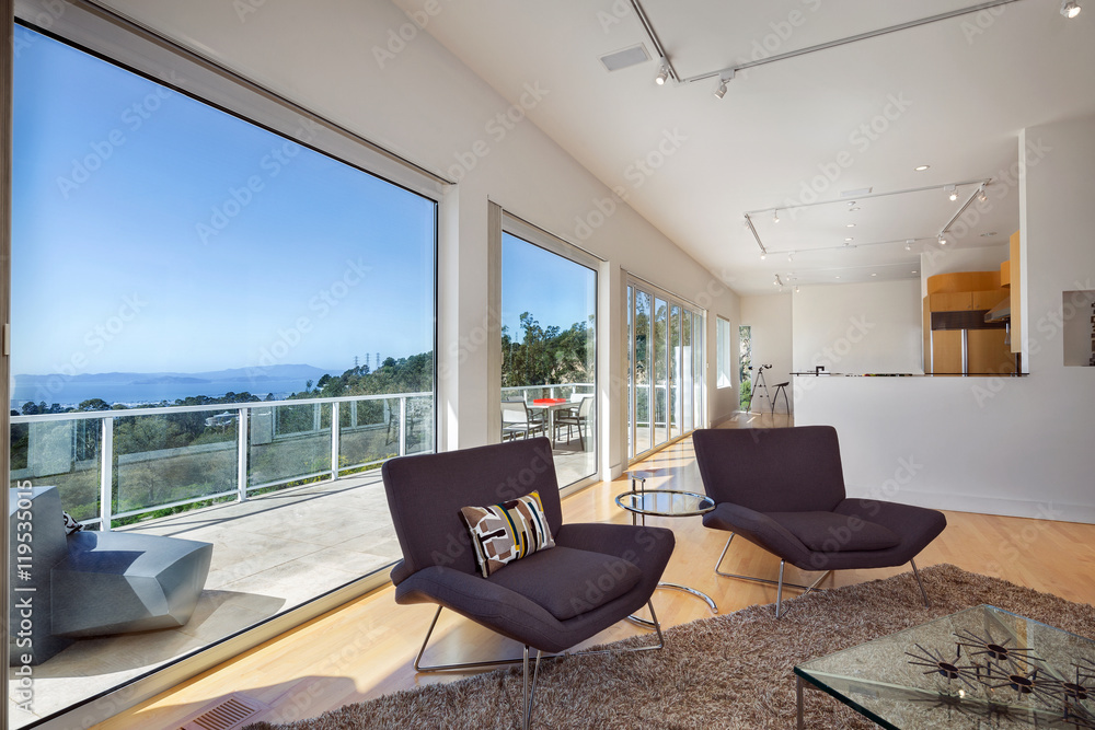 Fototapeta premium Modern living room with amazing view and large windows.