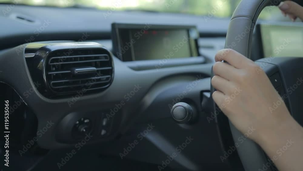 Woman driving car and using turn signal switch Woman driving car and using turn signal switch