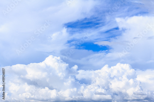 Blue sky background with white clouds. The vast blue sky and clouds sky on sunny day. White fluffy clouds in the blue sky.