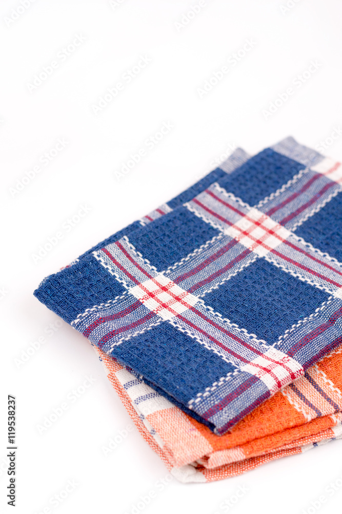 Blue and orange new kitchen dishtowels over white background Blue and orange new kitchen dishtowels over white background