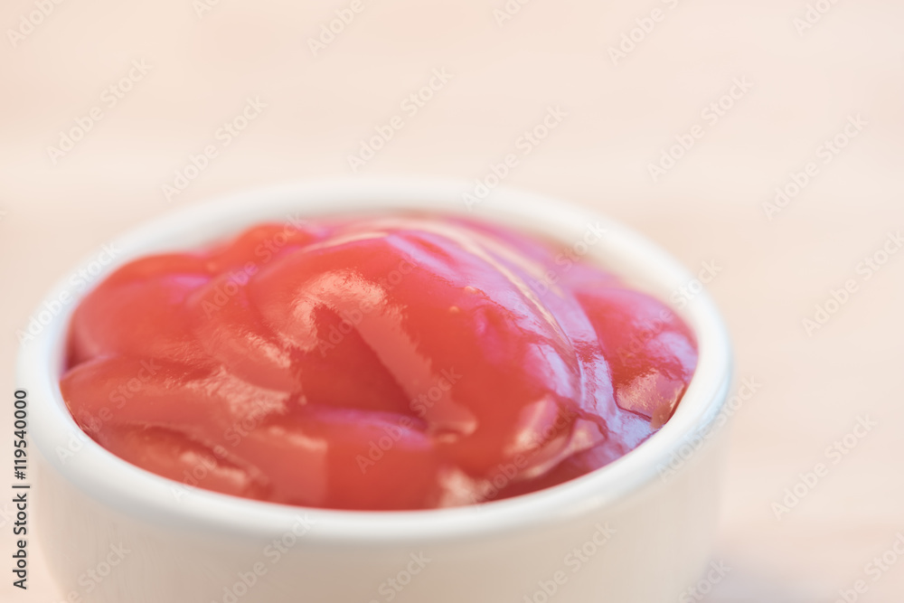 bowl of ketchup or tomato sauce on wooden table bowl of ketchup or tomato sauce on wooden table