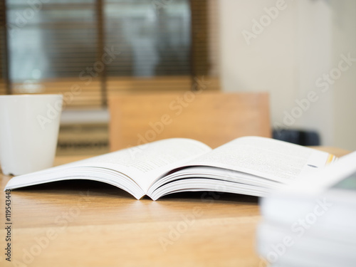  open book on wooden table