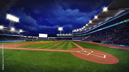 illuminated modern baseball stadium with spectators and green grass