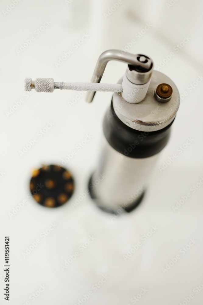 apparatus for removing growths on the skin - warts, papillomas, moles. Kriodestruktor on a white background closeup apparatus for removing growths on the skin - warts, papillomas, moles. Kriodestruktor on a white background closeup