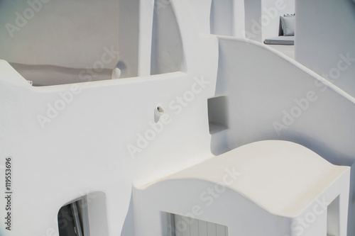 Fototapeta Naklejka Na Ścianę i Meble -  the beautiful white walls of the old Greek houses on the streets in Greece, Santorini