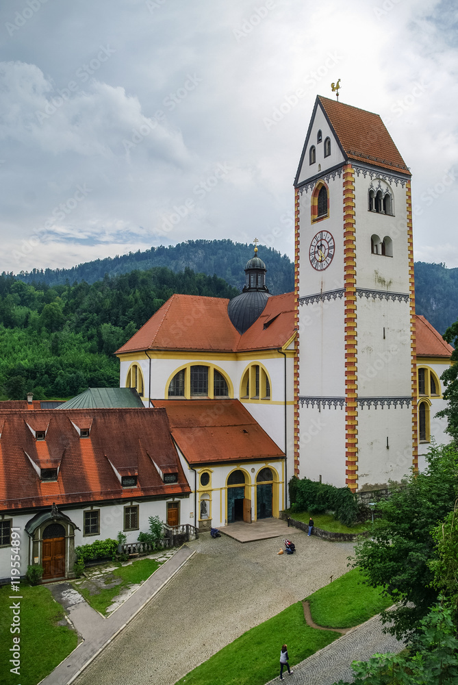 Clock tower of Hohes schloss, medieval castle in the middle of Fussen old town, Bavarian Alps, Germany Clock tower of Hohes schloss, medieval castle in the middle of Fussen old town, Bavarian Alps, Germany