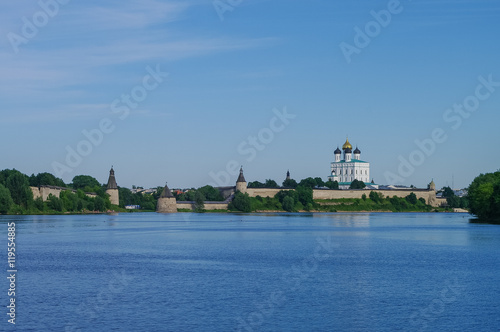 Panorama view from Volhov river of Trinity Cathedral, the bell tower and the walls and tower of Pskov Kremlin. Pskov, Russia