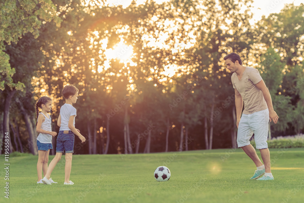 Family playing soccer