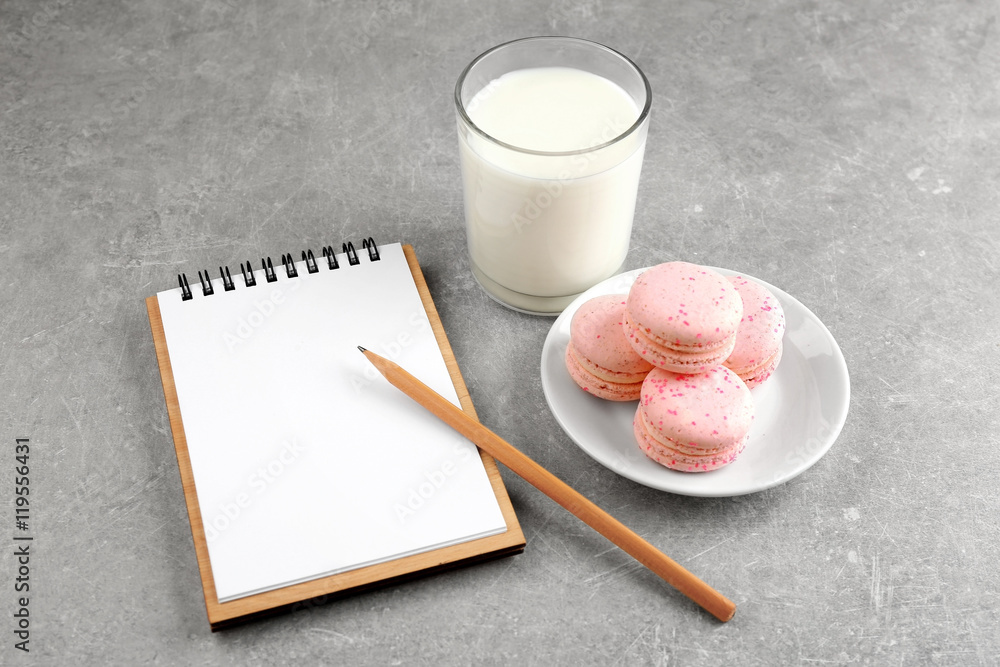 Notepad,milk and cookie on color background Notepad,milk and cookie on color background