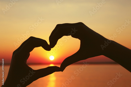 Love sign. Heart symbol against sunset