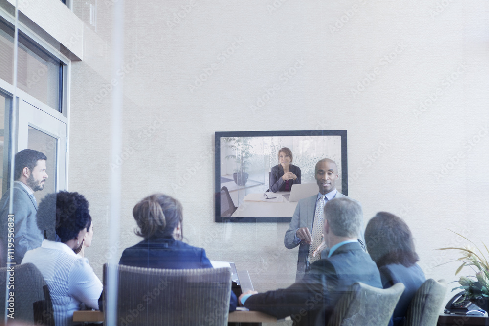 Businessman explaining colleagues during meeting in conference room Businessman explaining colleagues during meeting in conference room
