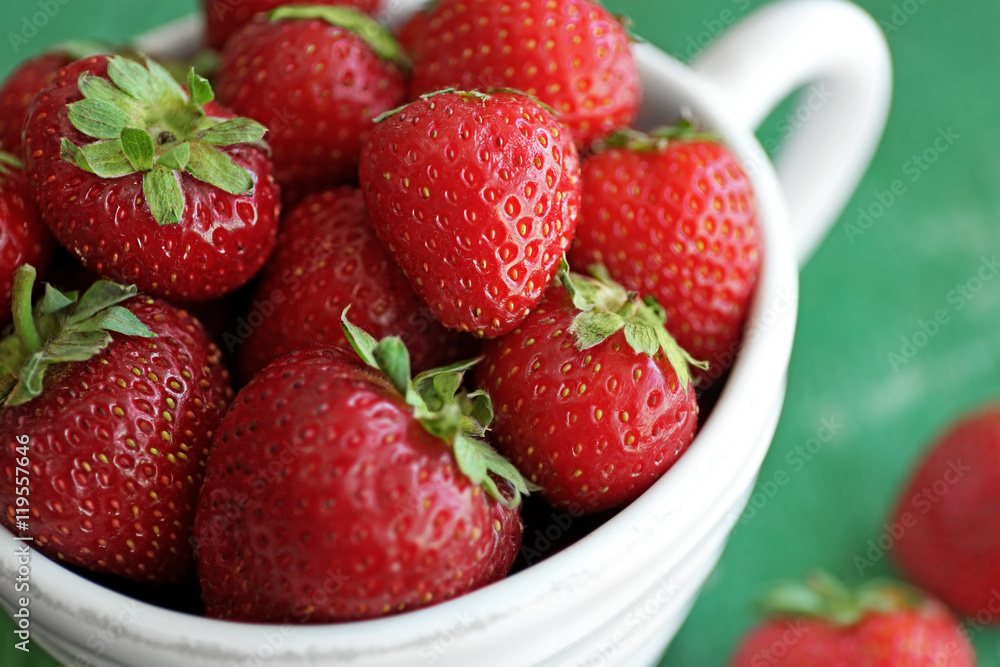 Fresh strawberries in cup, closeup Fresh strawberries in cup, closeup