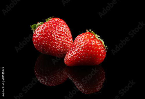 Fresh strawberries on black background