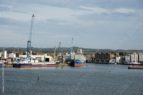 Poole Harbour Dorset UK - Cargo ships load and unloading on the quaysid