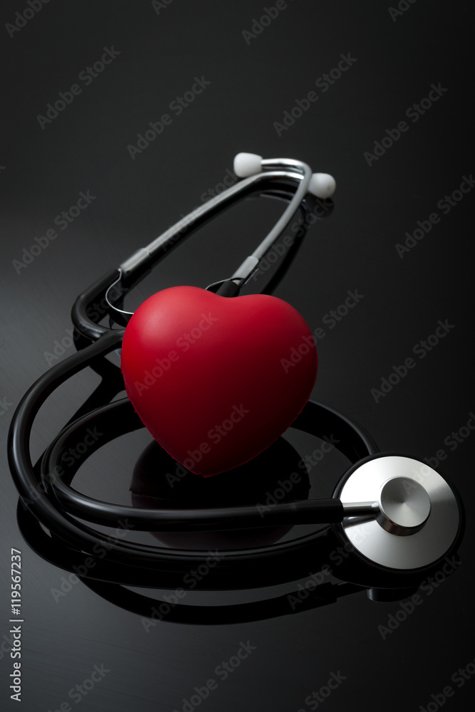 Stethoscope and heart for blood pressure check up on black background Stock  Photo | Adobe Stock