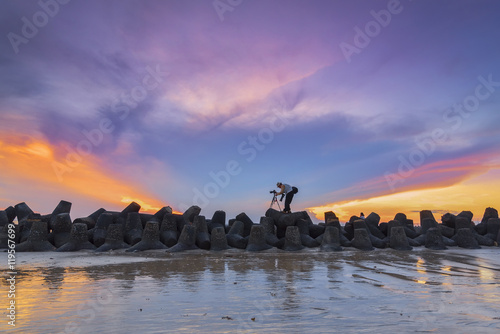 Wallpaper Mural Silhouette of photographer taking photo at dramatic sunset Bali, Indonesia Torontodigital.ca
