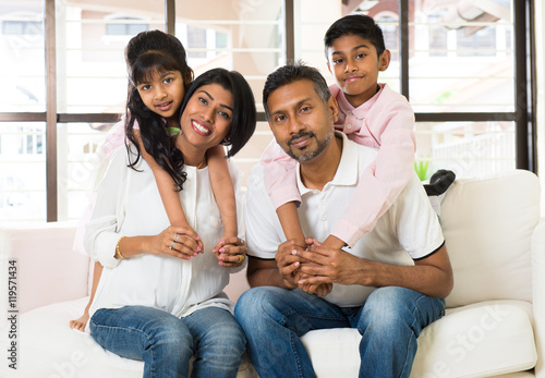 happy indian family at living room