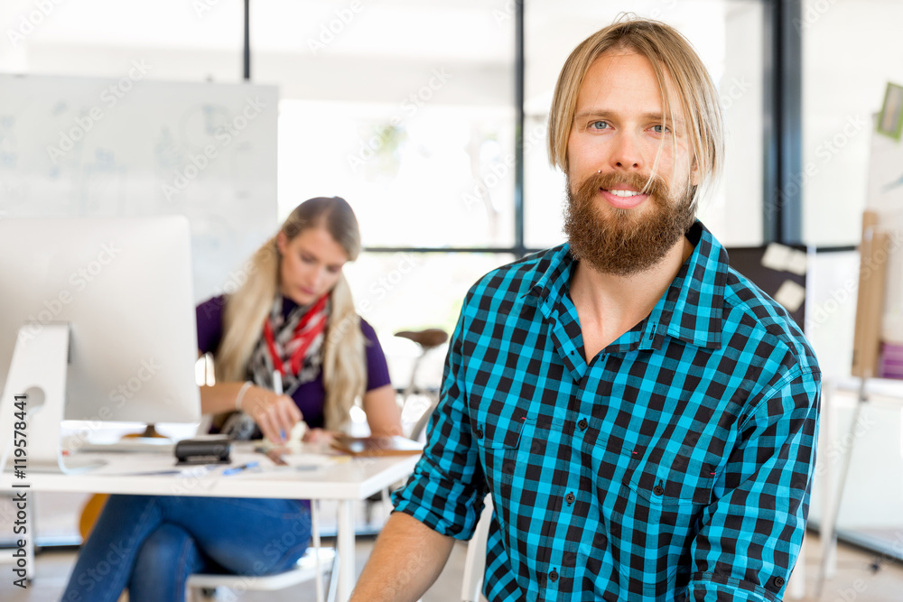 Fototapeta premium Young man working in office