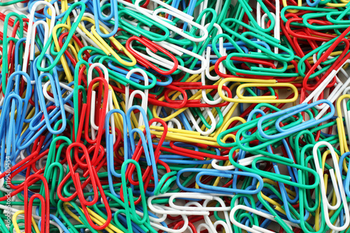 A close up image of multicolored paper clips
