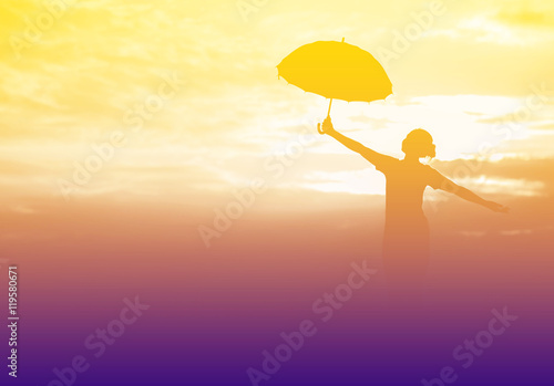 Umbrella woman and sunset silhouette © stcom