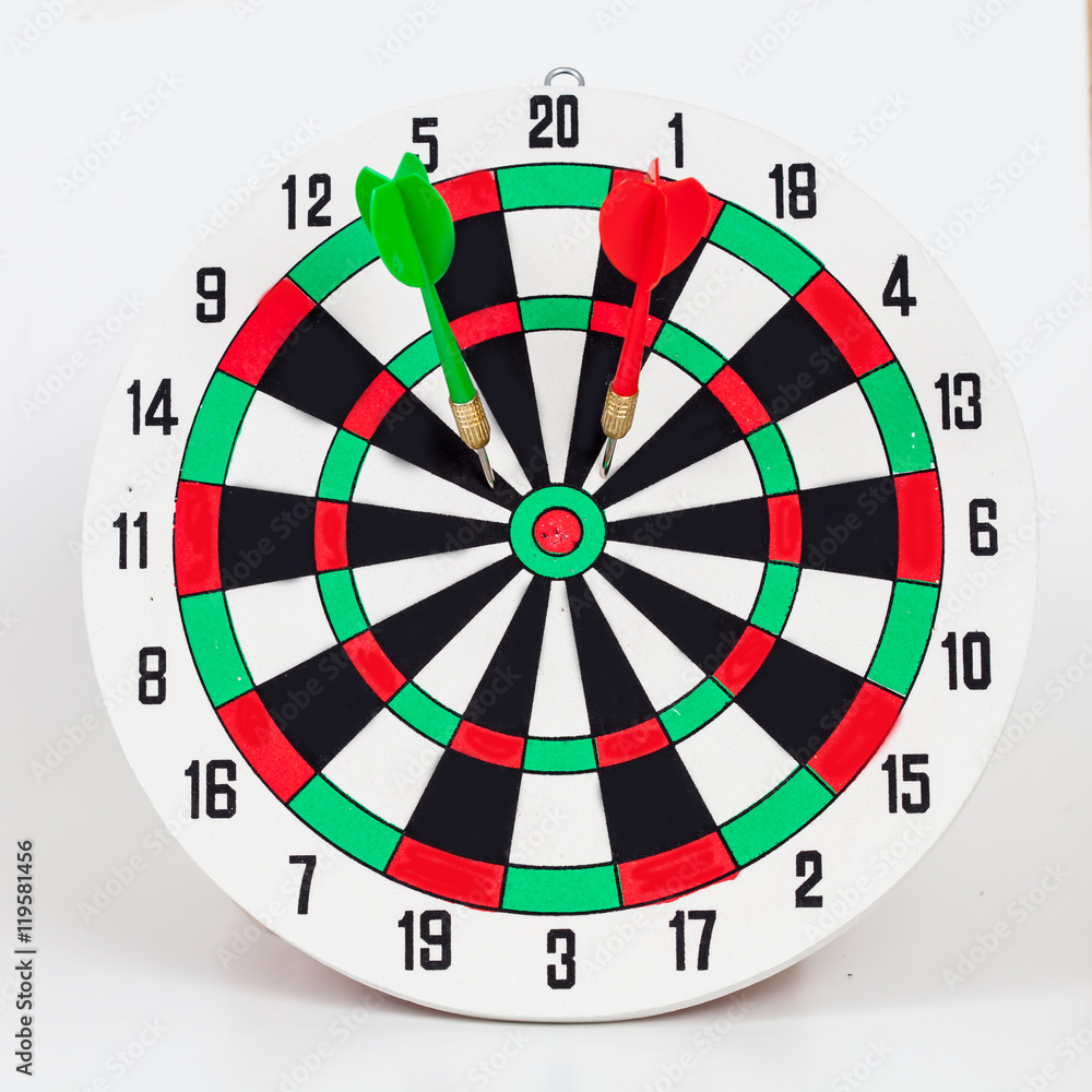 Dart arrow hitting in bullseye on dartboard Dart arrow hitting in bullseye on dartboard