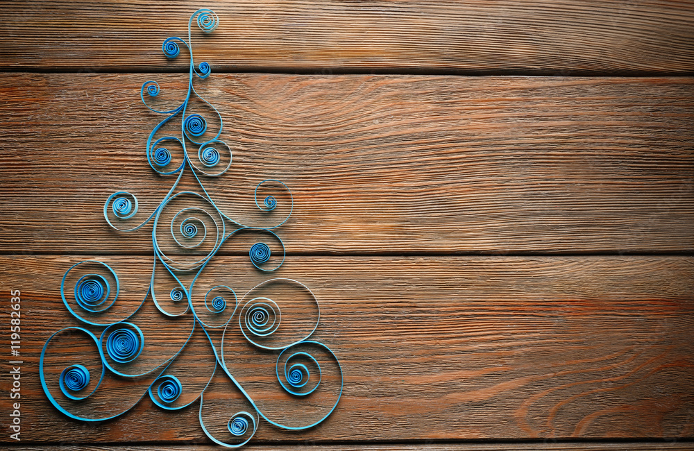 Paper Christmas tree on wooden background Paper Christmas tree on wooden background